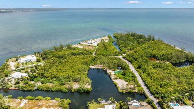 PRIME 11.4-ACRE DEVELOPMENT OPPORTUNITY WITH BOAT HOUSE POTENTIAL IN DESIRABLE RED BAY, HERON BAY