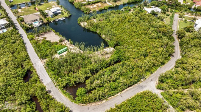 PRIME 11.4-ACRE DEVELOPMENT OPPORTUNITY WITH BOAT HOUSE POTENTIAL IN DESIRABLE RED BAY, HERON BAY