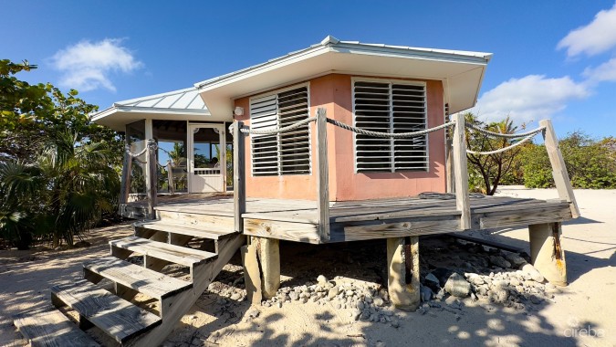 LITTLE CAYMAN LAND WITH BEACHFRONT COTTAGE